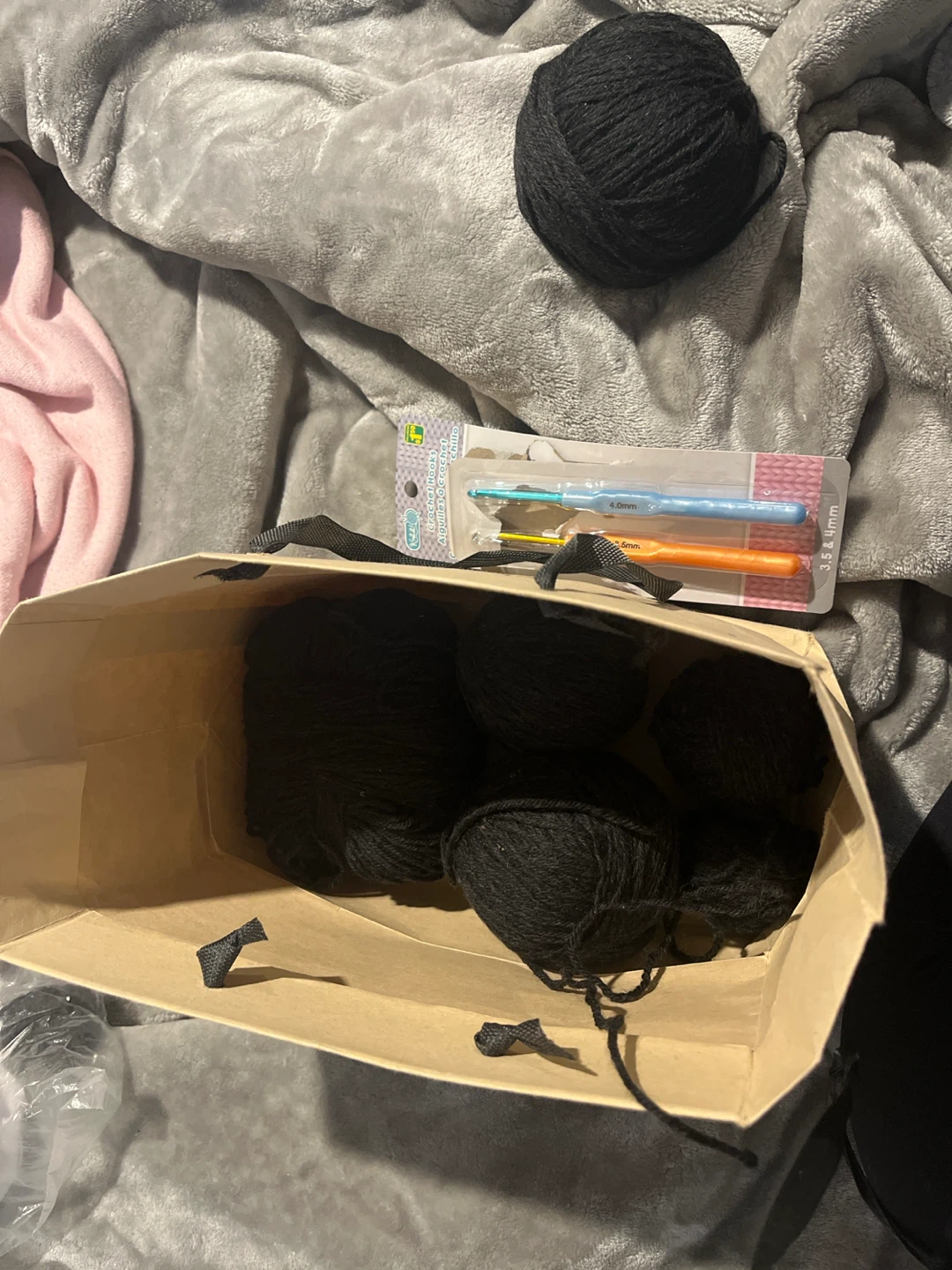 Black Yarn and Crochet Hooks