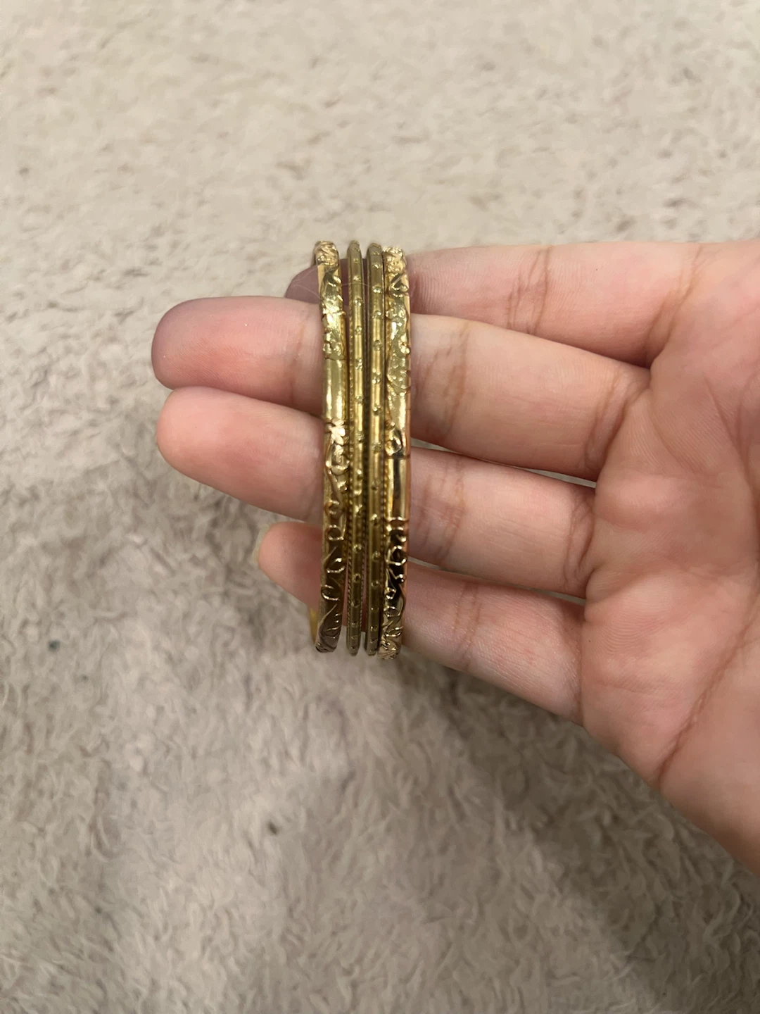 Set of 4 etched gold-tone bangles