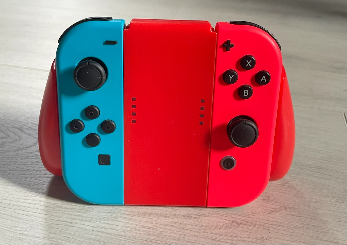 Authentic Red & Blue Nintendo Switch Joy-Con Controllers + Grip