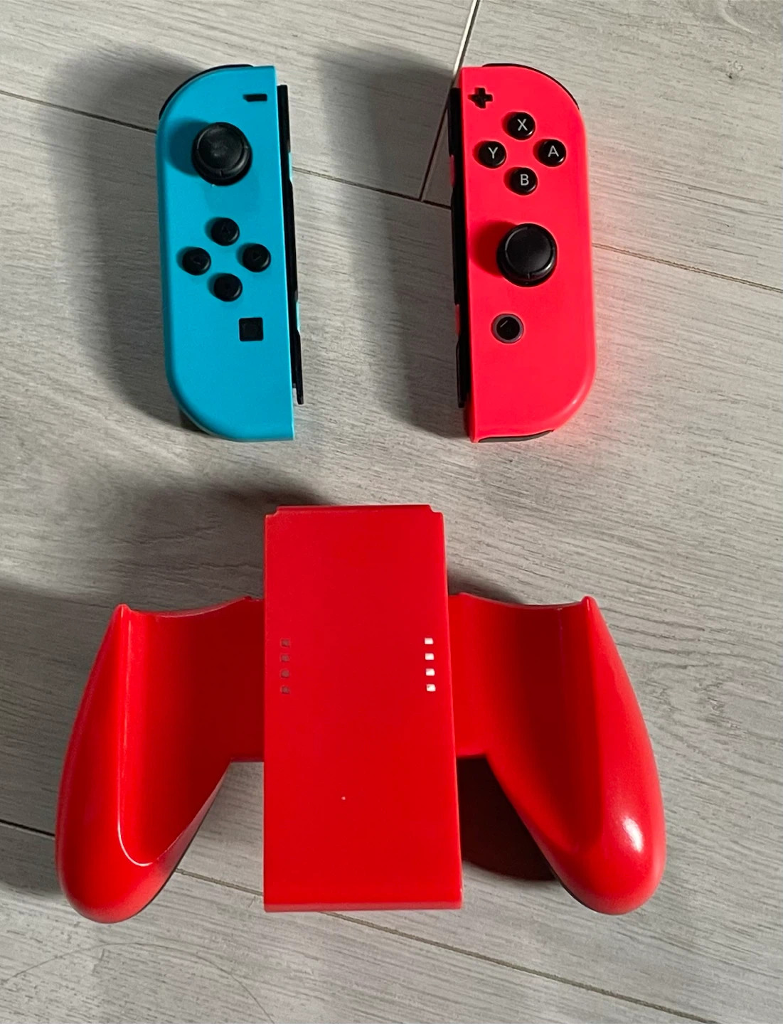 Authentic Red & Blue Nintendo Switch Joy-Con Controllers + Grip - photo 2