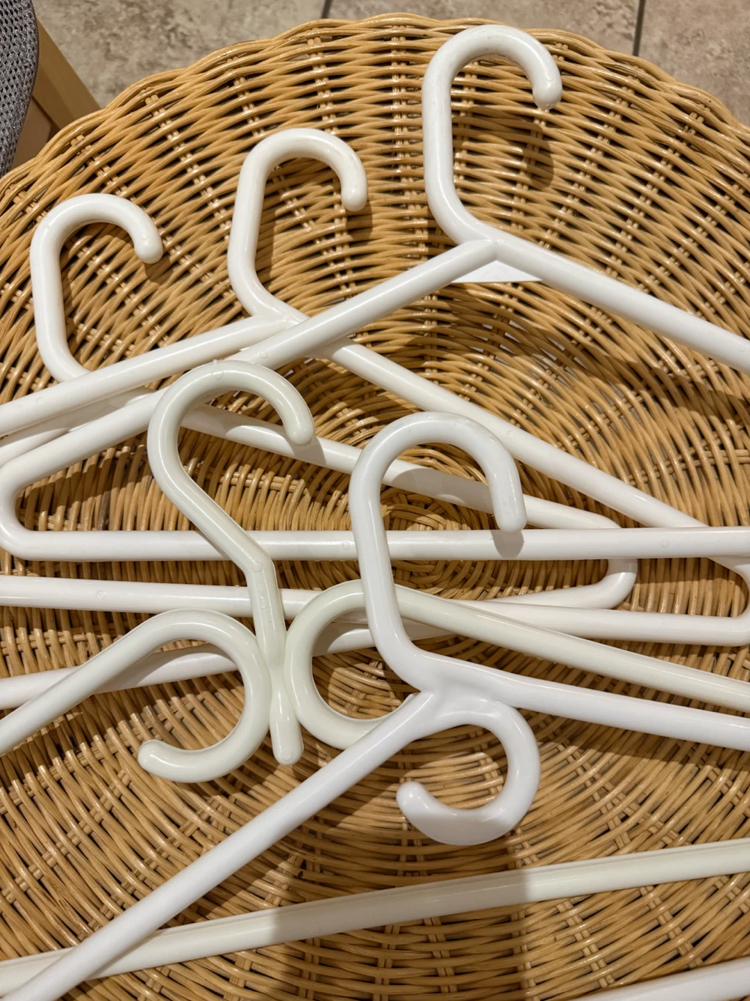 Set of 5 white plastic clothes hangers