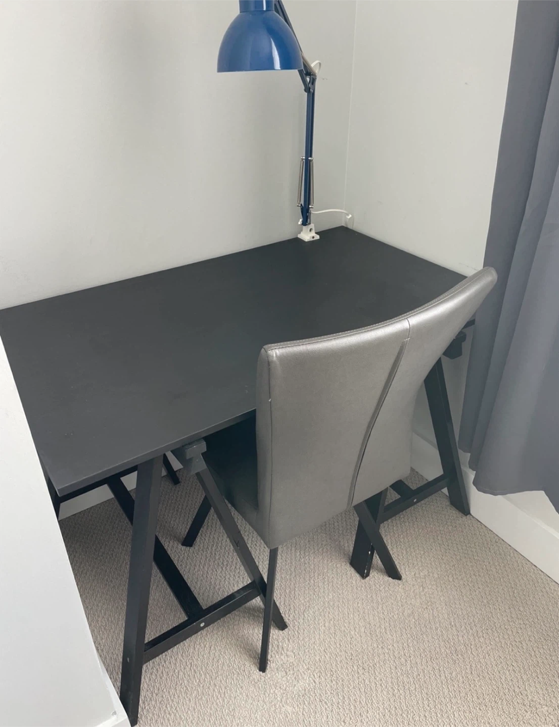 Black trestle desk with grey chair