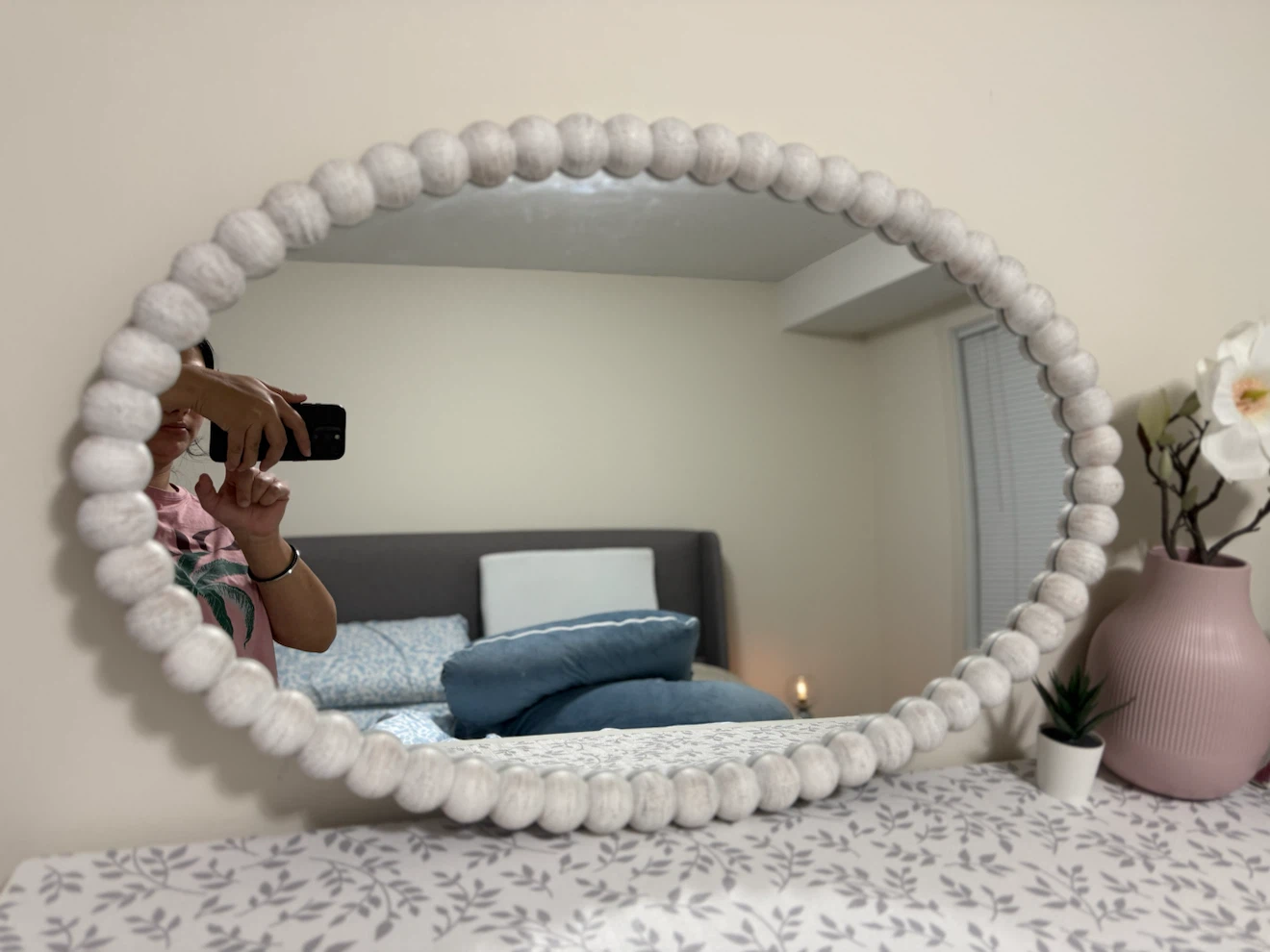 Oval beaded wall mirror