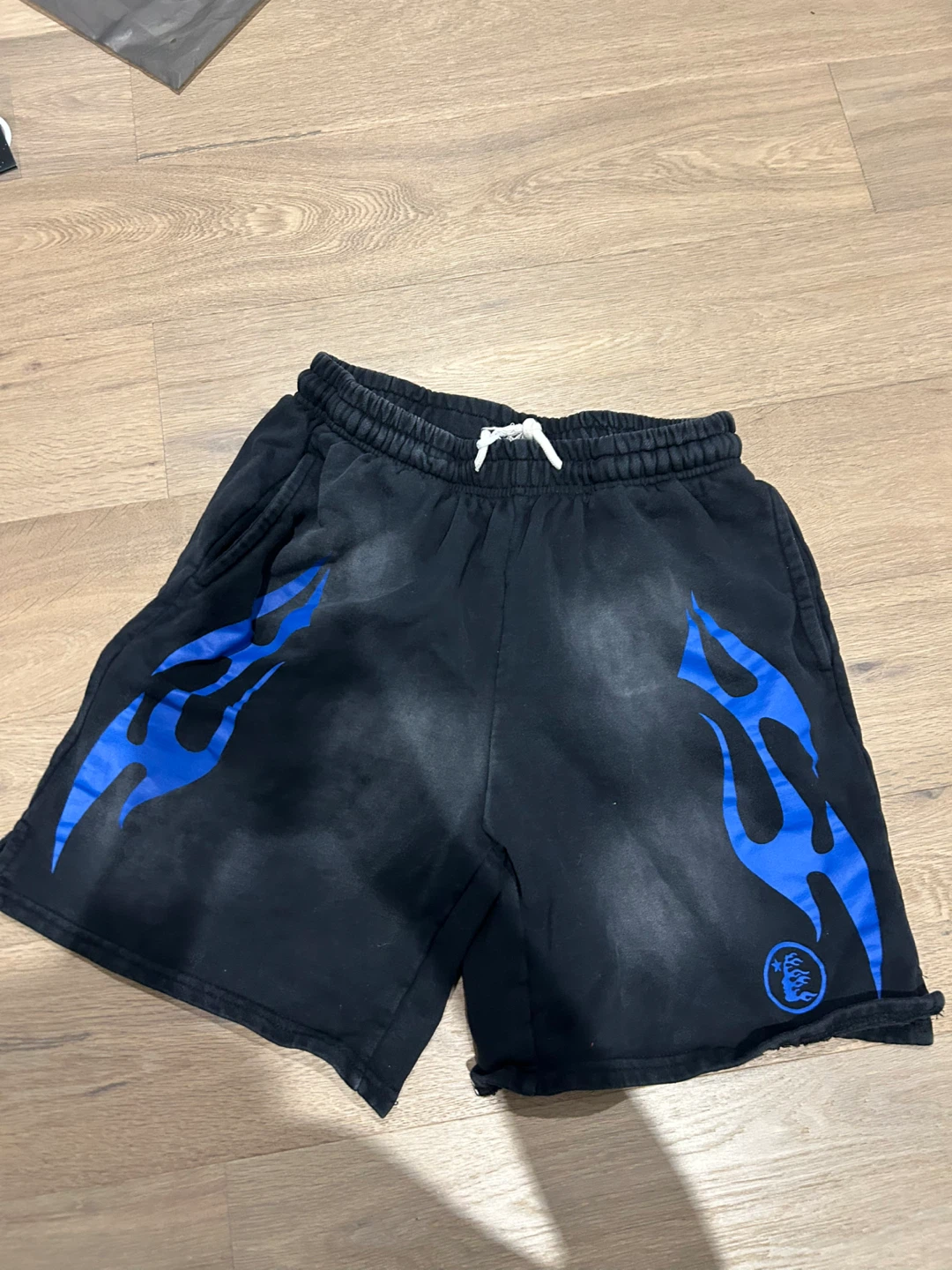 Black shorts with blue flame design