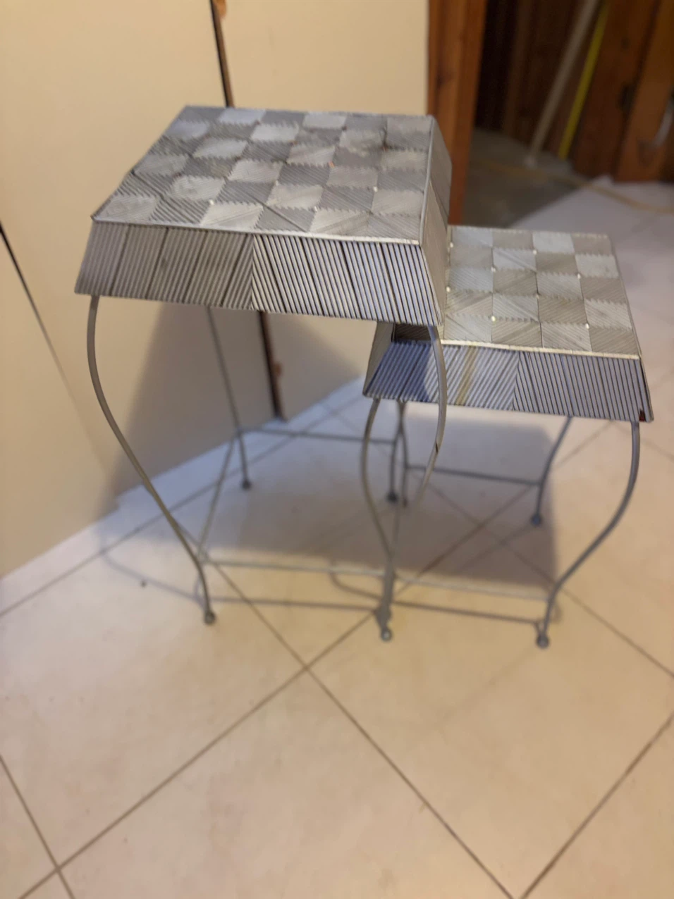 Set of two silver metal nesting tables