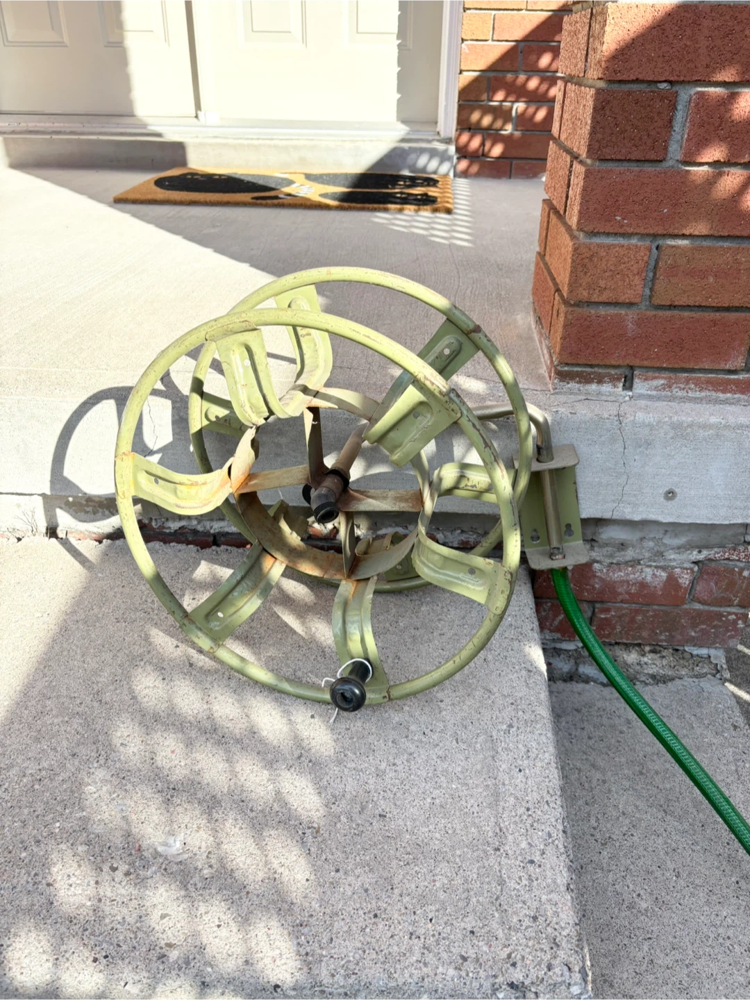 Vintage metal green wall mounted garden hose reel