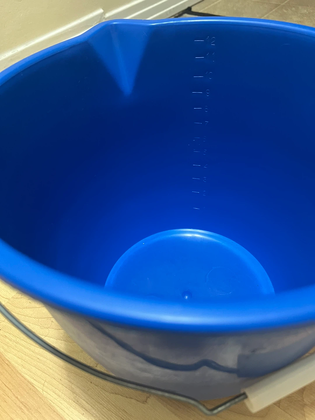 Blue Bucket and White Dish Drying Rack