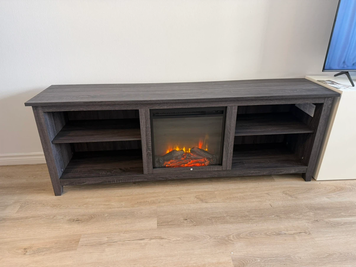 Brand new. Kneeland 70" TV Stand with Electric Fireplace.