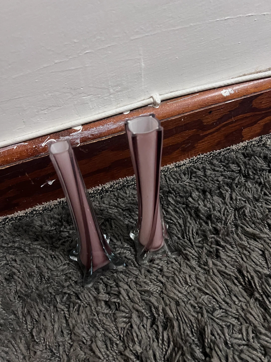 Set of two purple glass bud vases