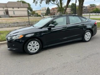 Black Ford Fusion Sedan