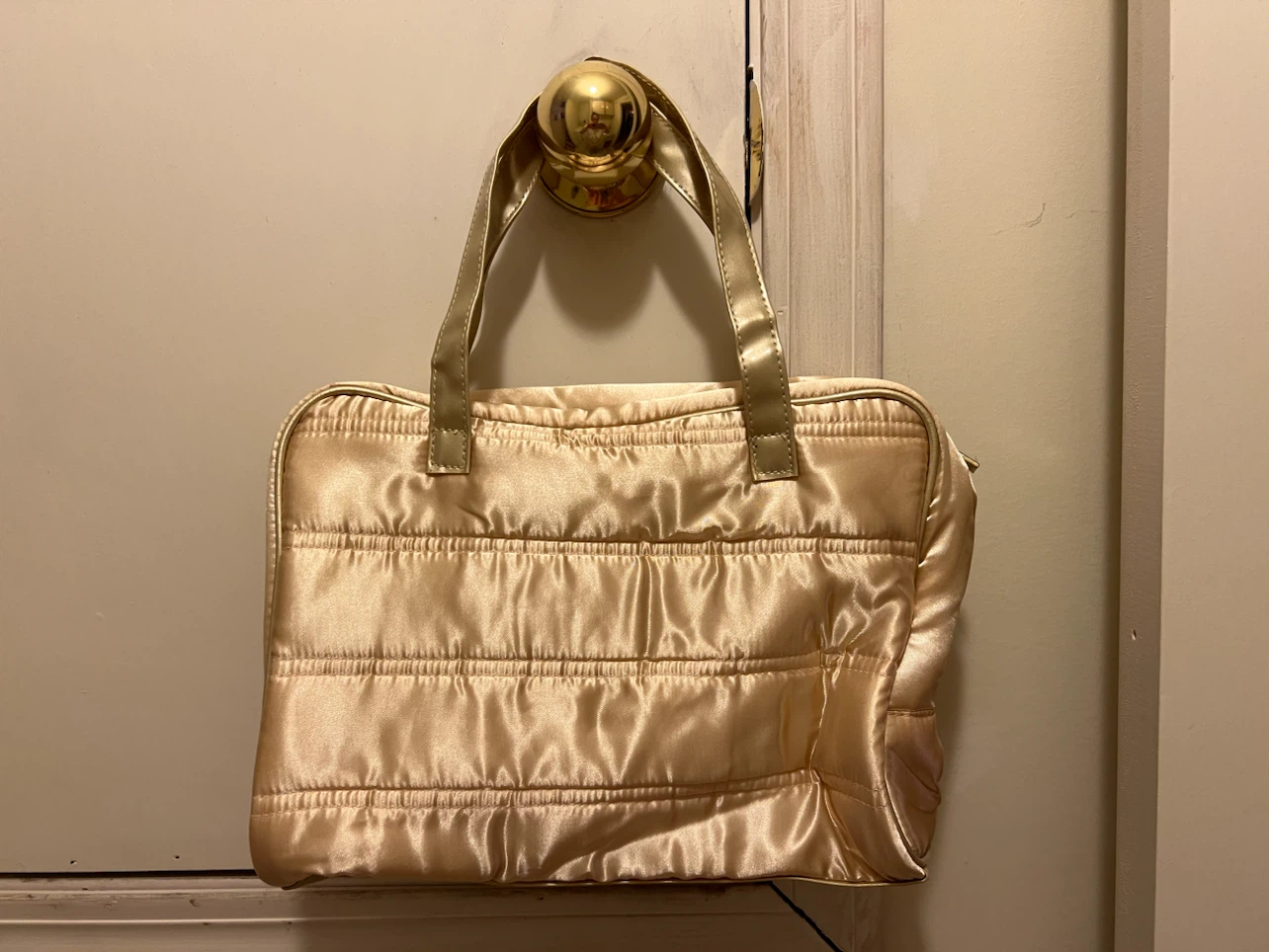 Gold quilted handbag