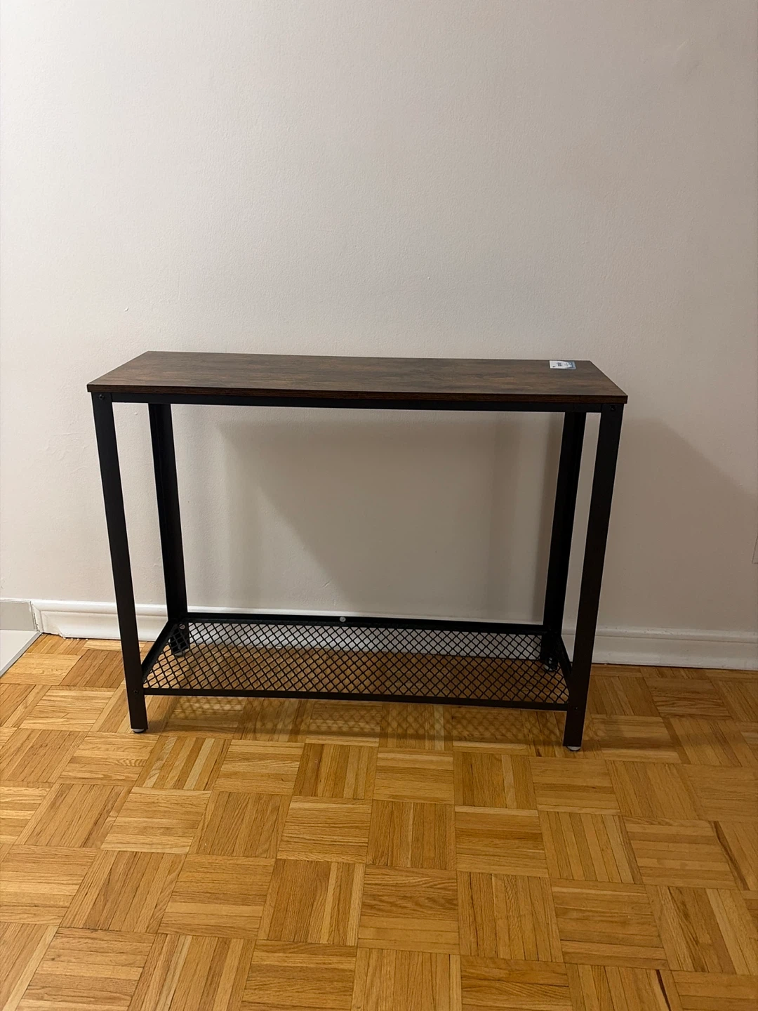 Industrial console table with metal mesh shelf