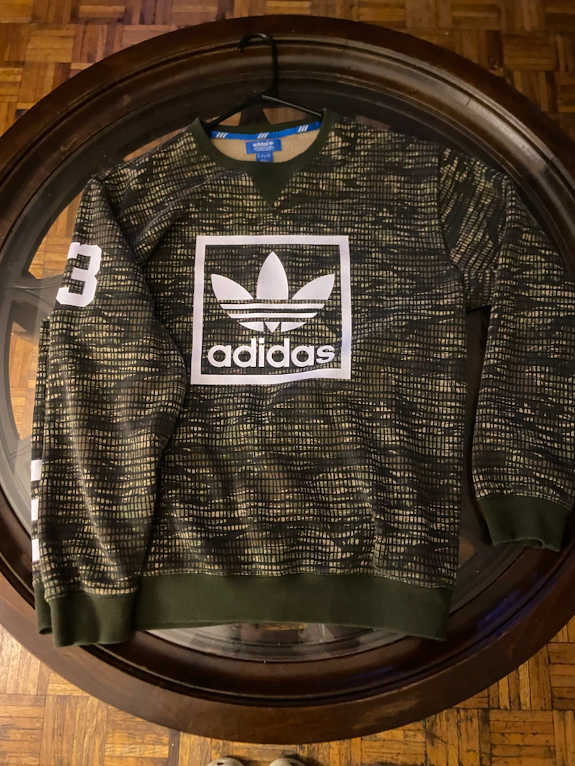 This is an Adidas Originals Camo Trefoil