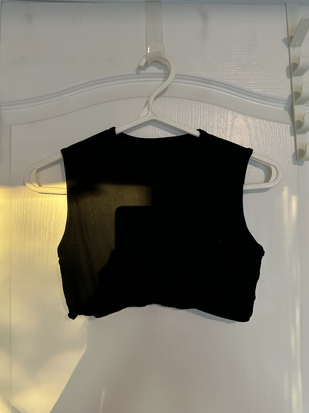 Black sleeveless cropped top