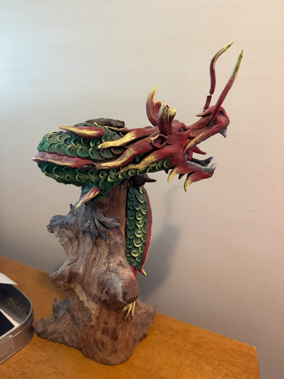 Red and Green Dragon Statue on Wood Base