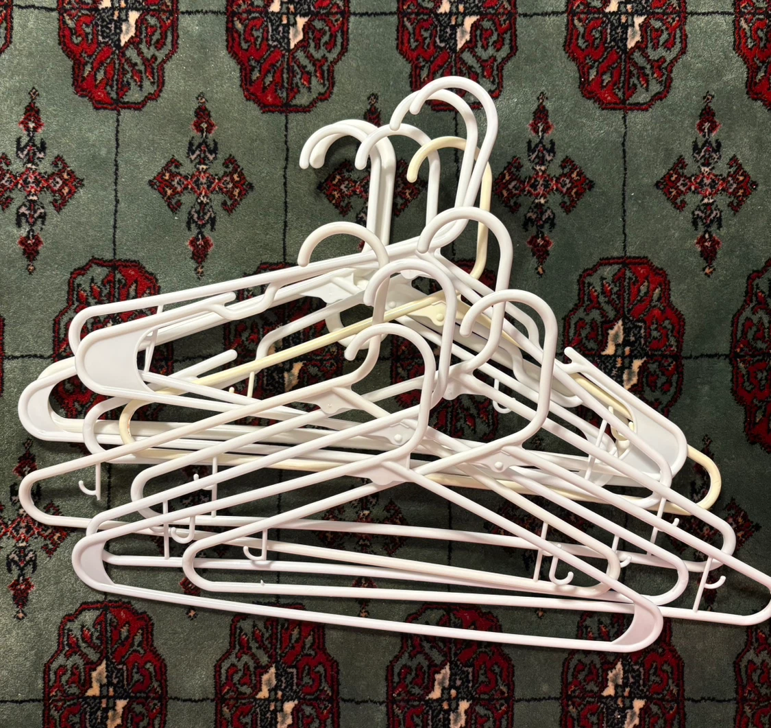 Set of White Plastic Clothes Hangers