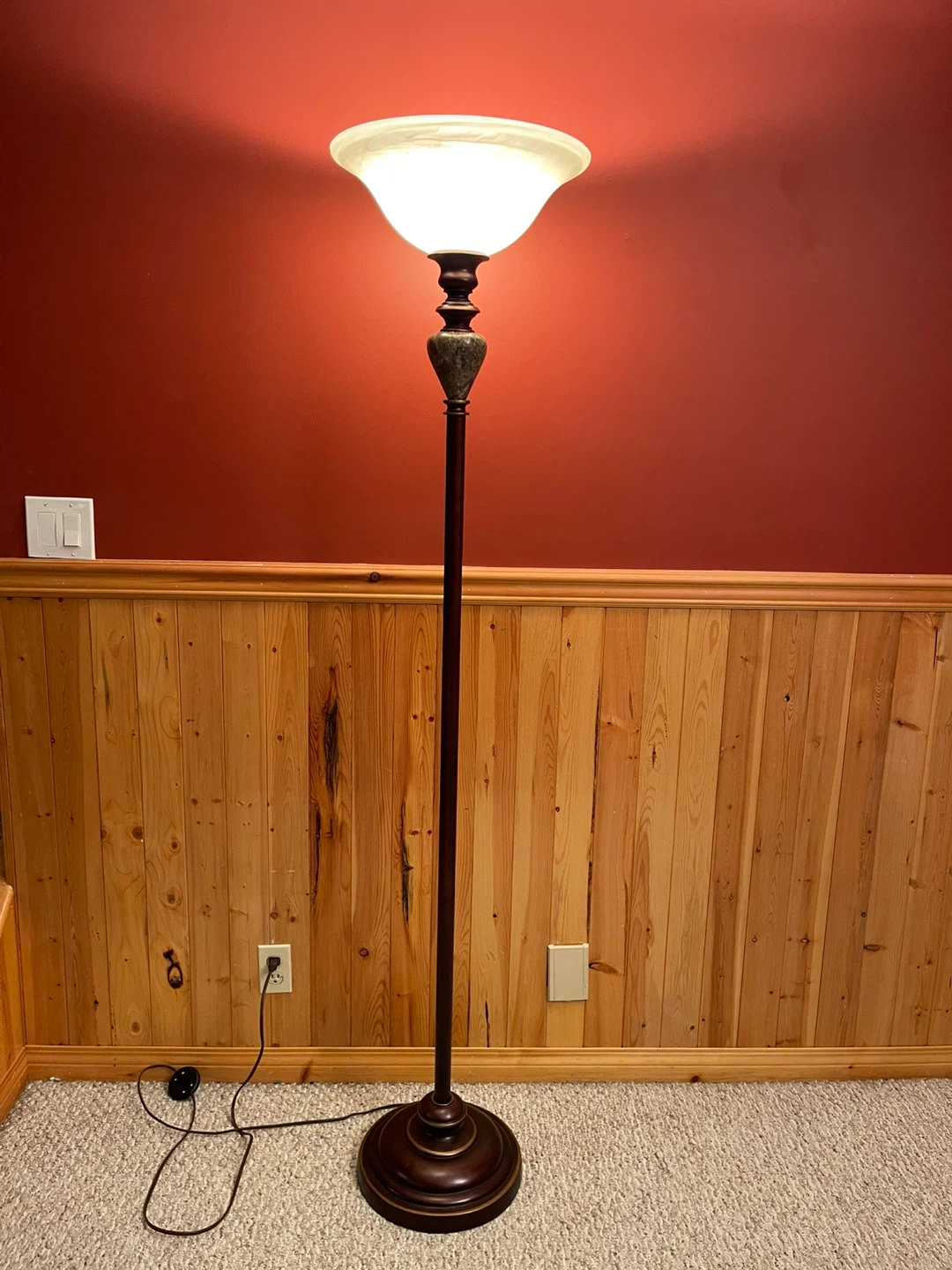 A beautiful stained glass torchiere floor lamp