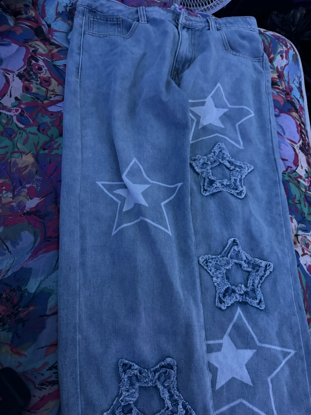 Light wash jeans with star detailing