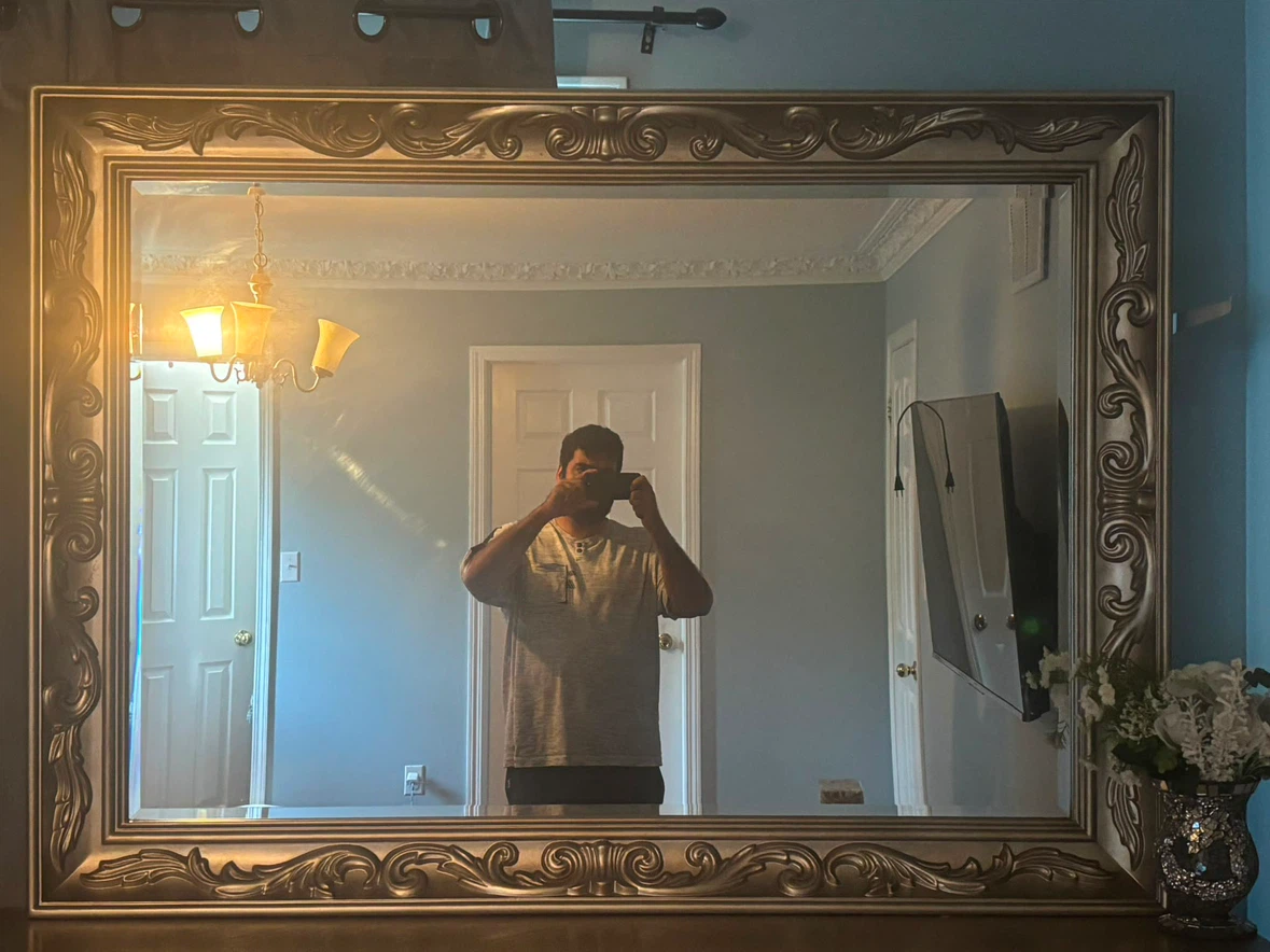 Large ornate gold-toned wall mirror and Dresser
