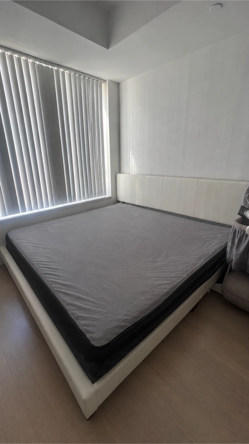 White upholstered queen bed frame
