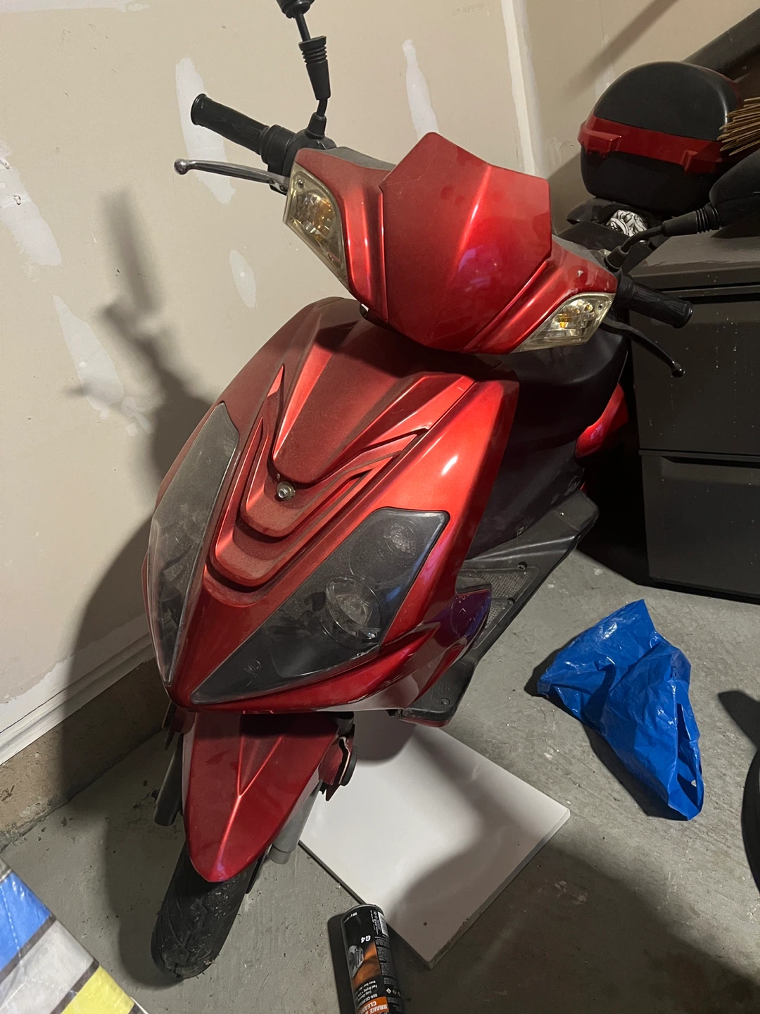 Red gas scooter with storage case