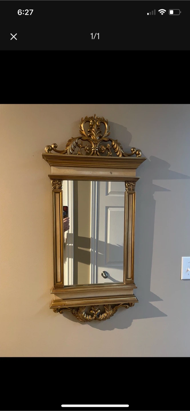 Ornate gold-toned wall mirror