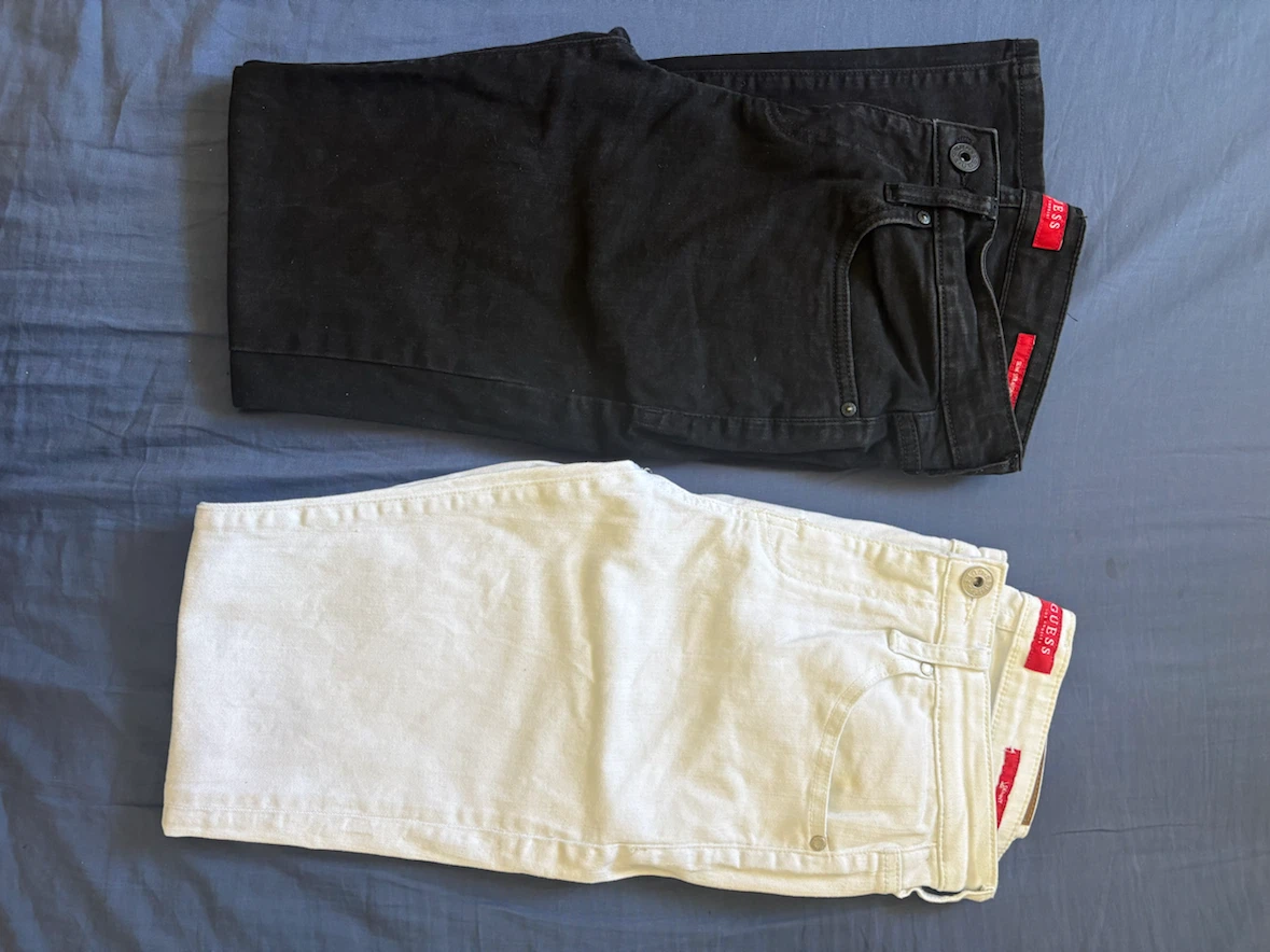 Two pairs of Guess jeans, black and white