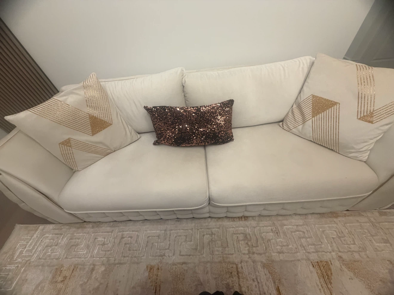 Cream tufted Turkish sofa with gold accents