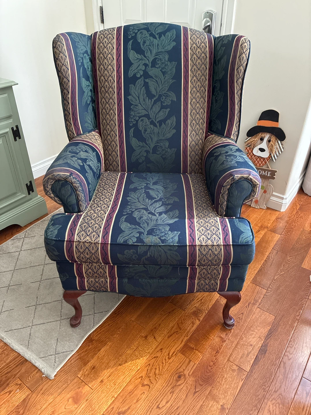 Traditional patterned wingback armchair