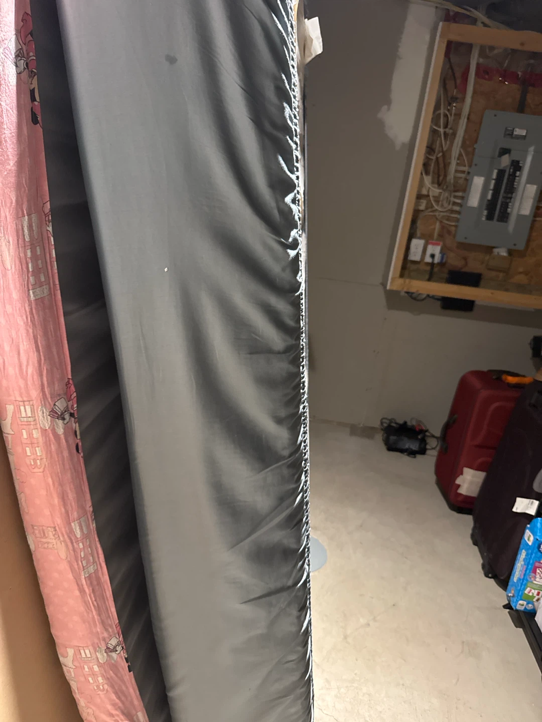 Single Mattress with Grey Bed Sheet