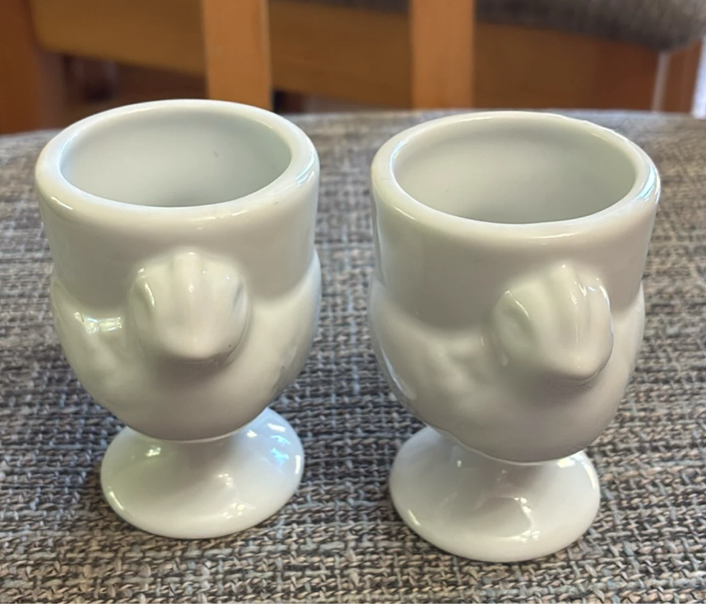 Two white ceramic bird egg cups