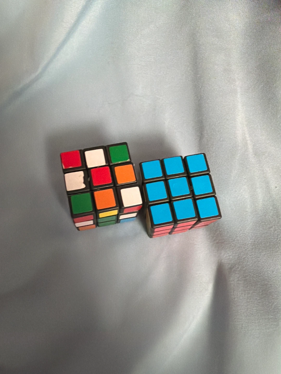 Two 3x3 Rubik's Cube style puzzles