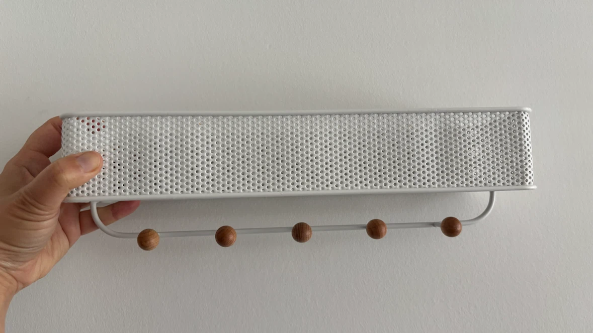 Umbra white wall shelf with hooks