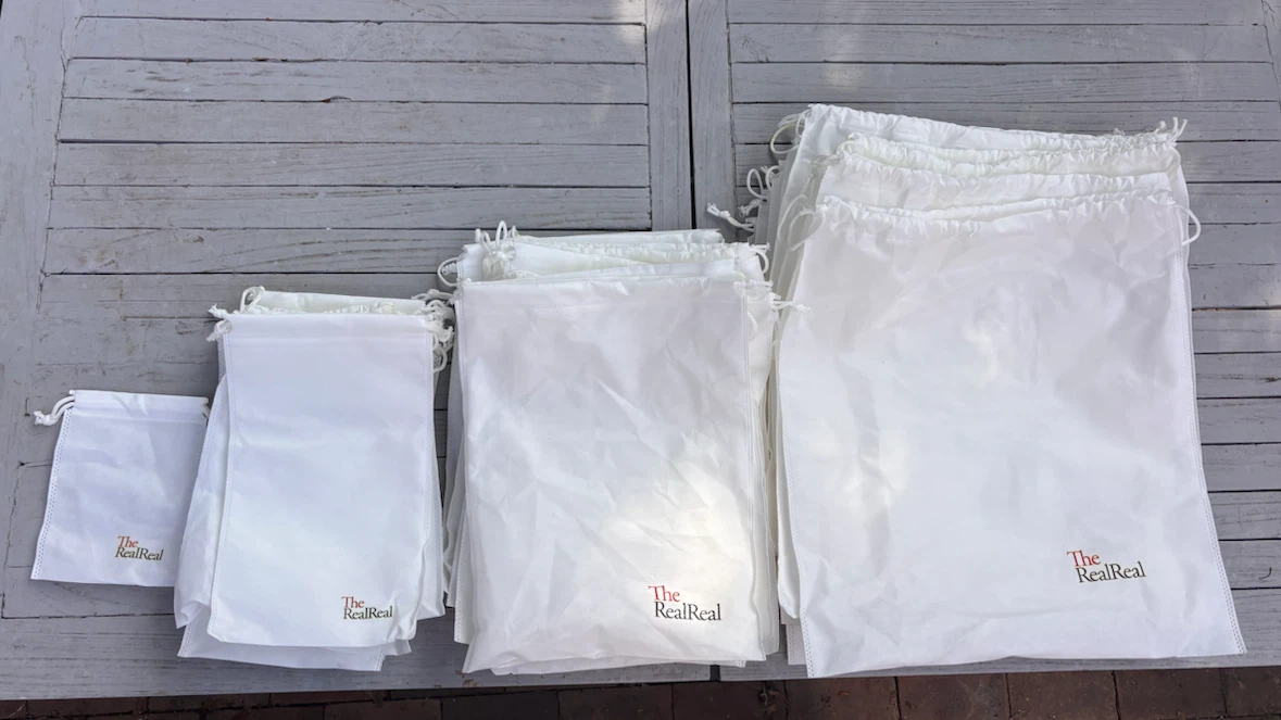 Lot of The RealReal clothing Bags