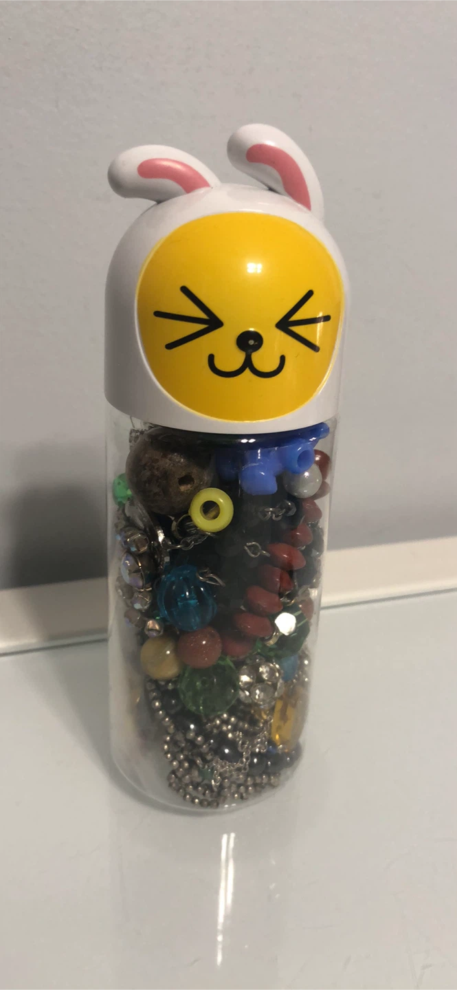 Assorted Beaded Jewelry in Novelty Container