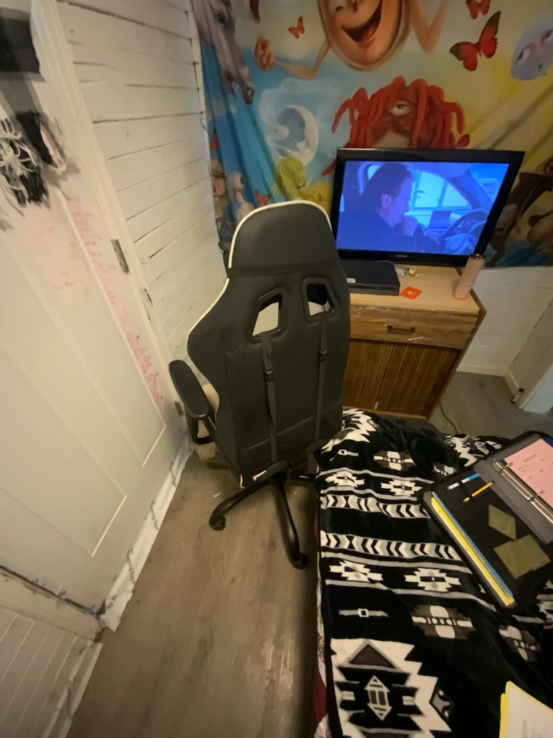 Black and white gaming chair with footrest