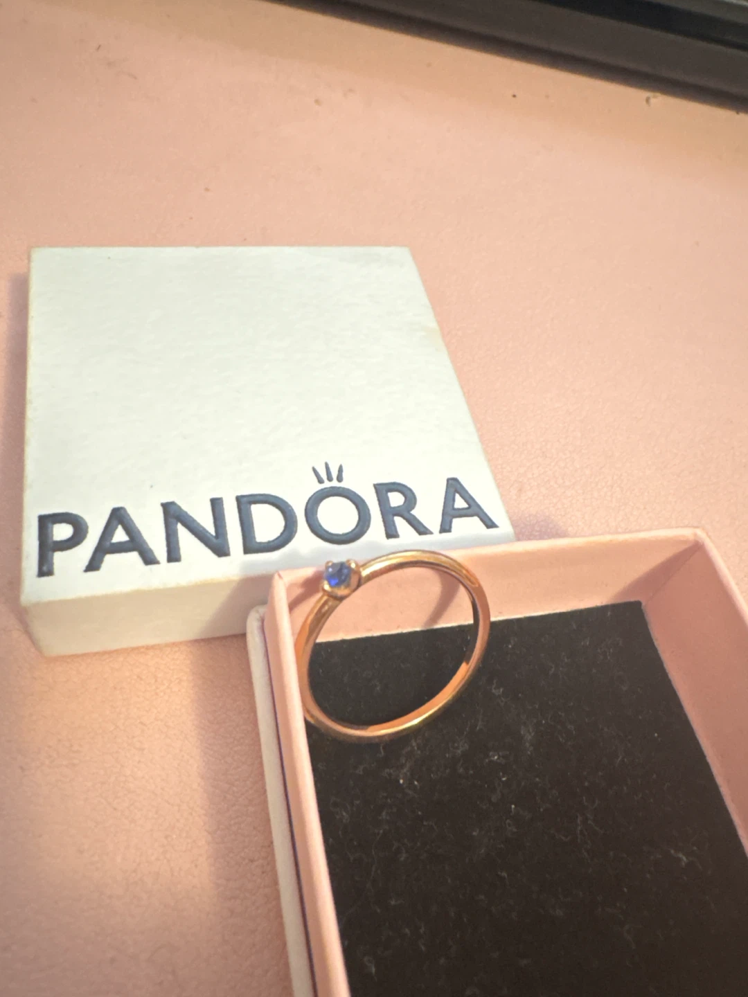 Pandora rose gold ring with blue stone