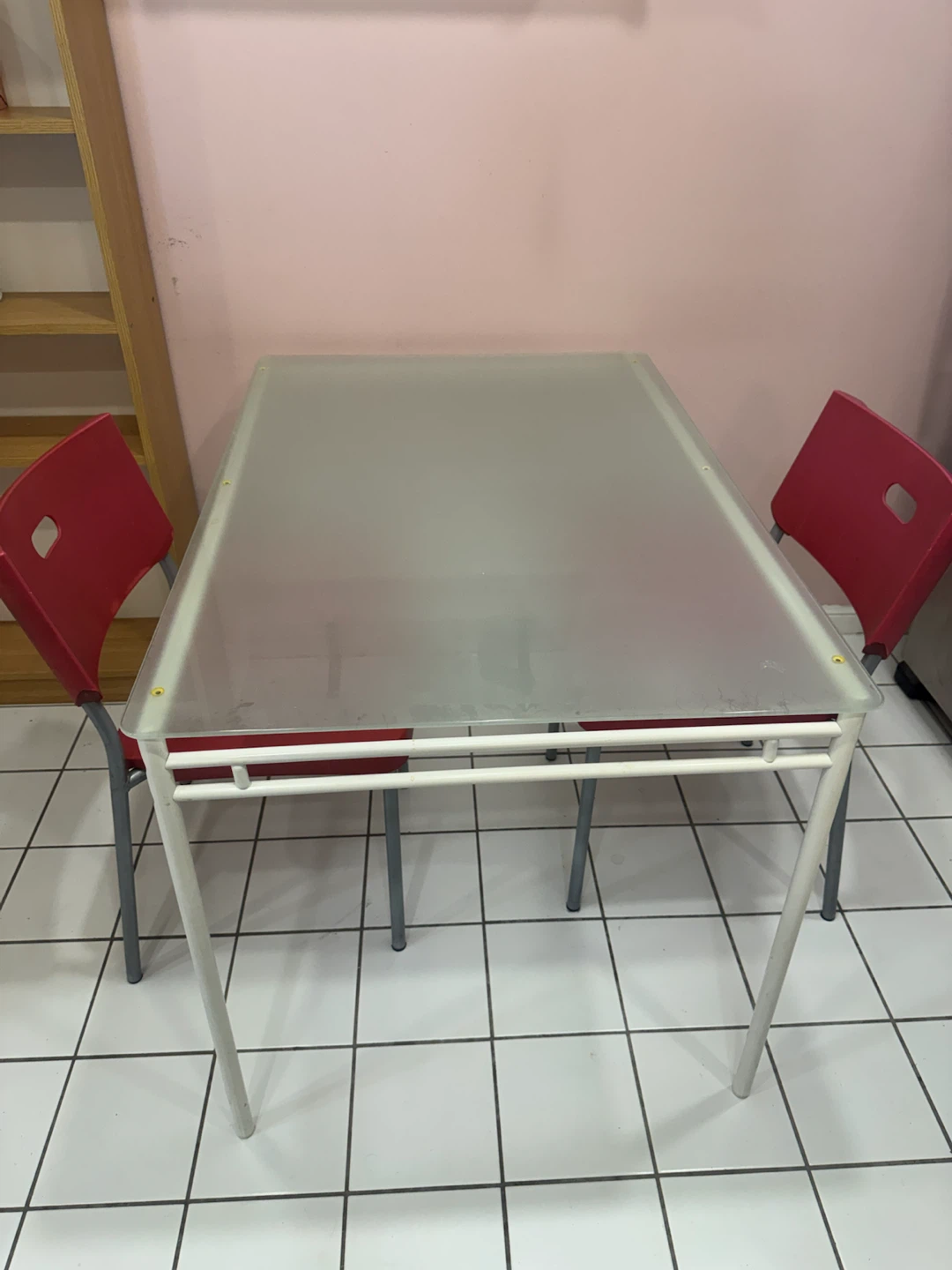 Glass Dining Table and Two Red Chairs