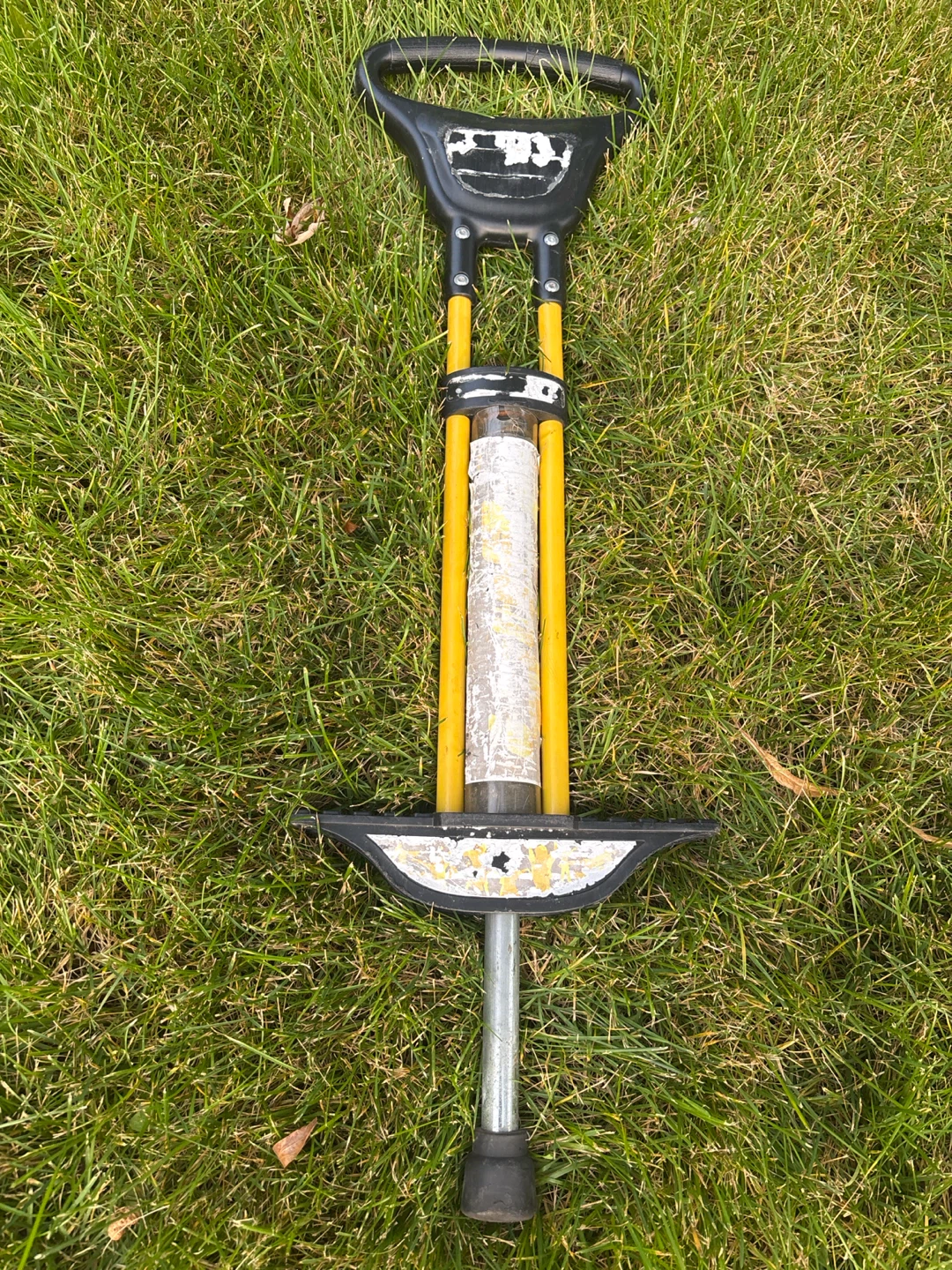 Old Yellow and Black Pogo Stick