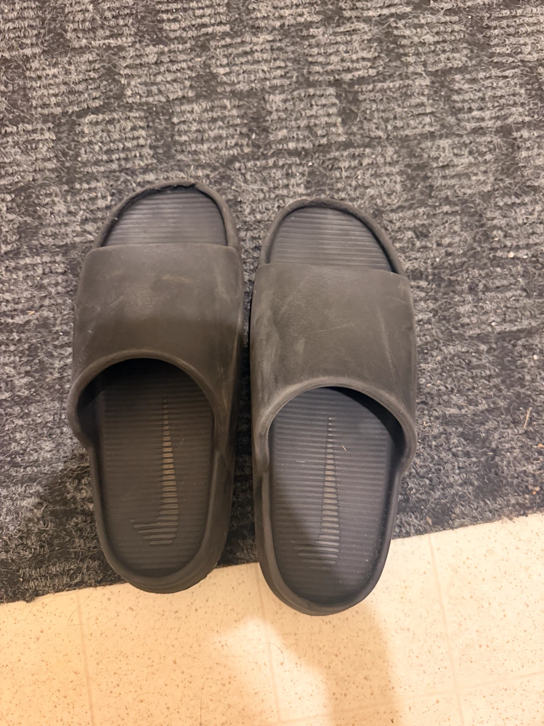 Black Nike slides