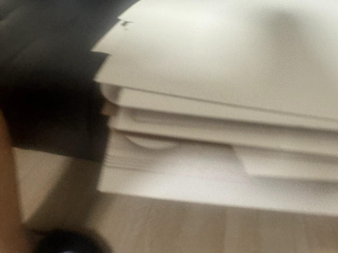 Stack of Unassembled White Cardboard Boxes