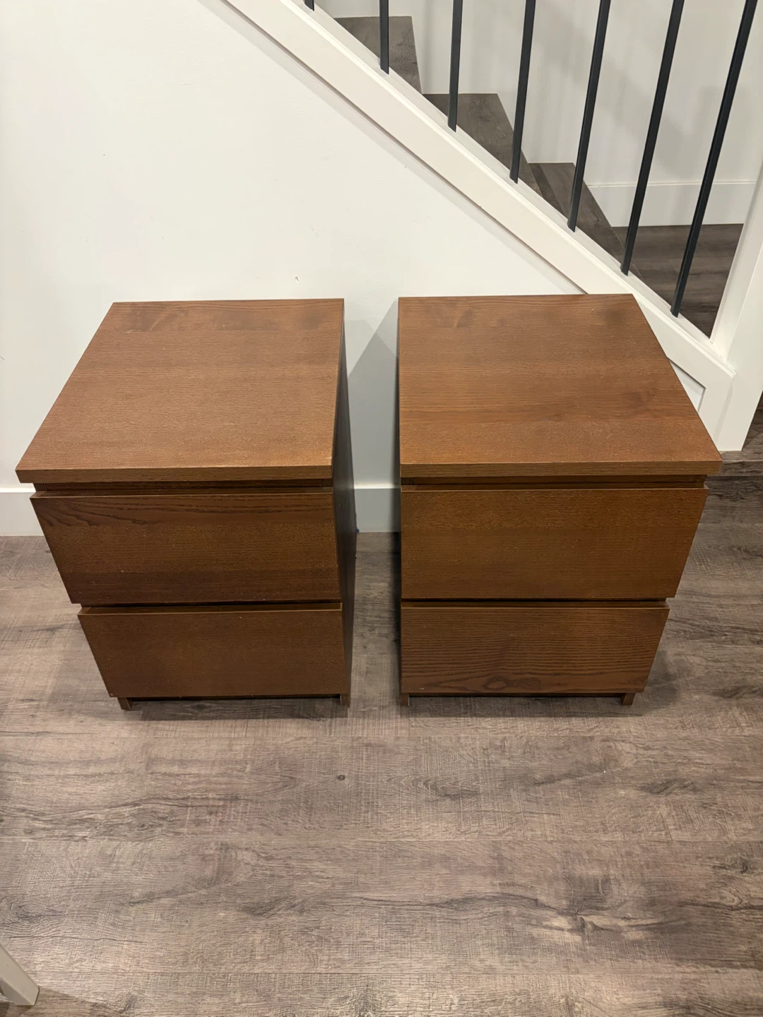 pair of IKEA nightstands in brown