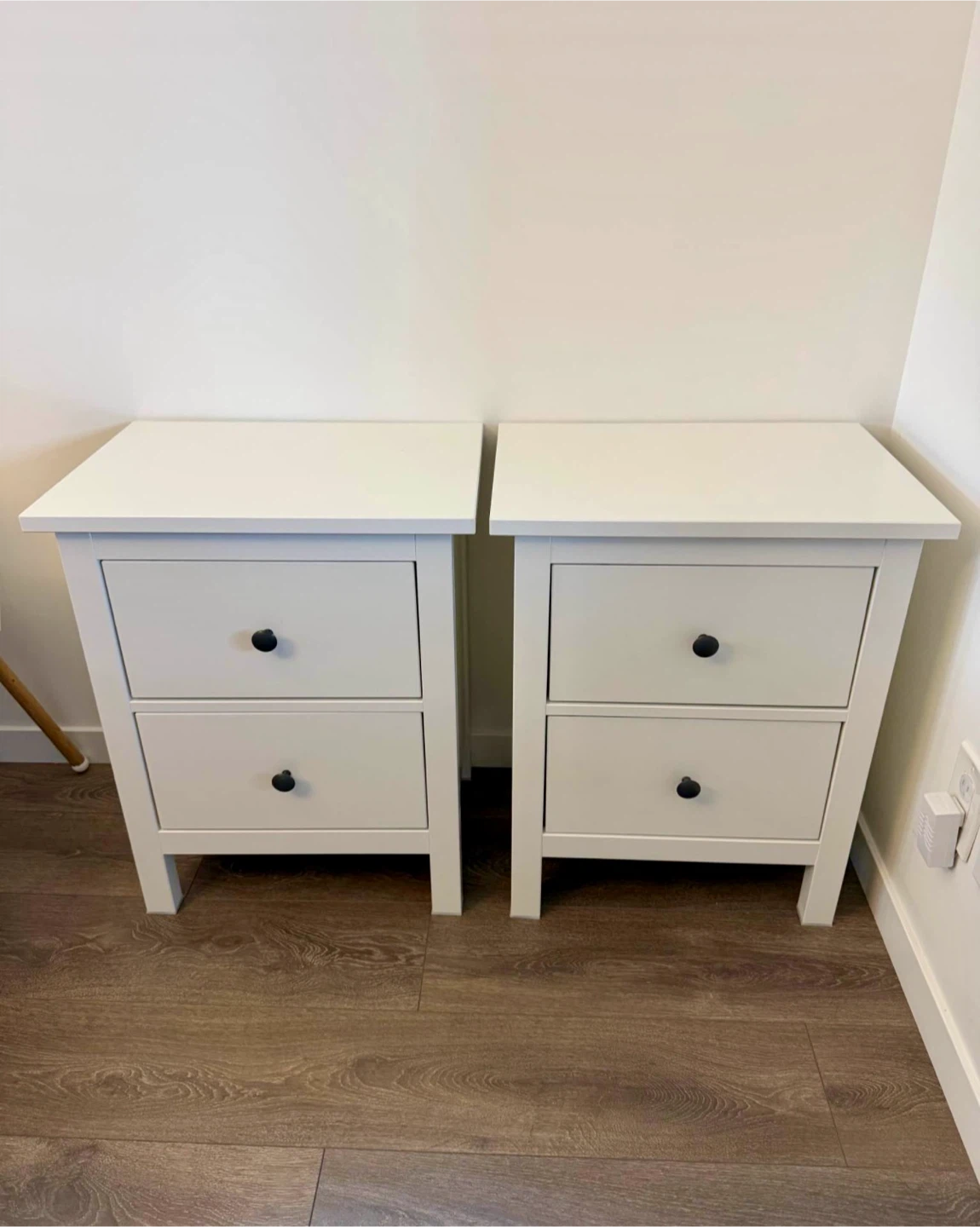pair of IKEA nightstands in white