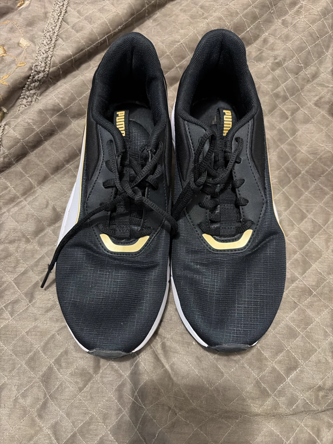 Puma Black and Gold Sneakers