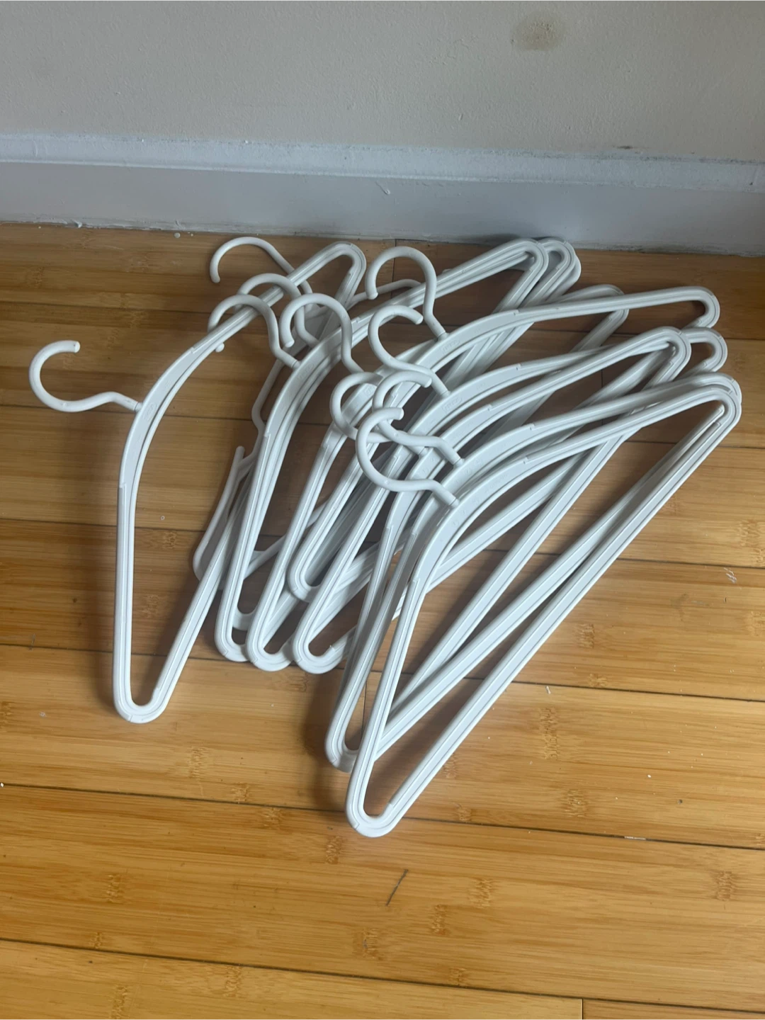 10 White Plastic Hangers