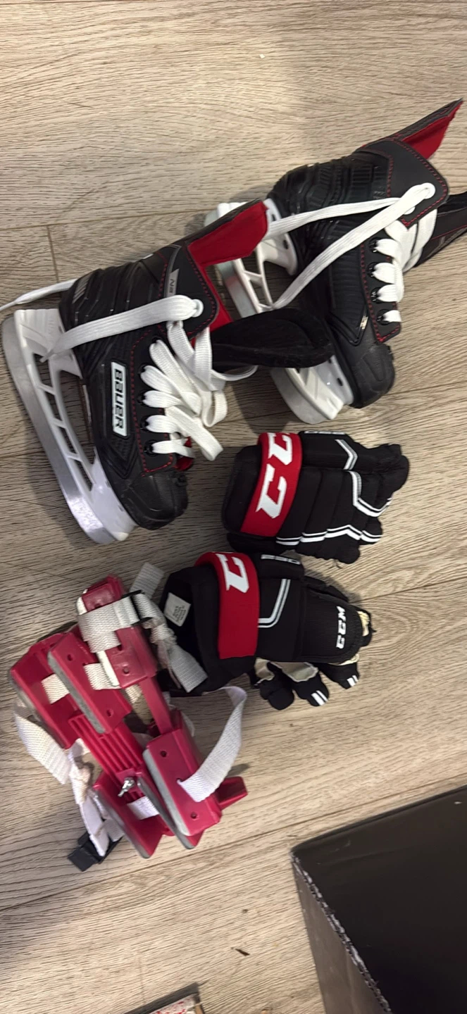 Bauer skates and CCM hockey gloves