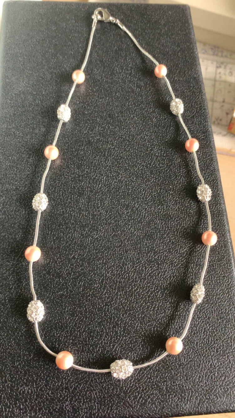 Silver-tone necklace with pink pearls and rhinestone beads