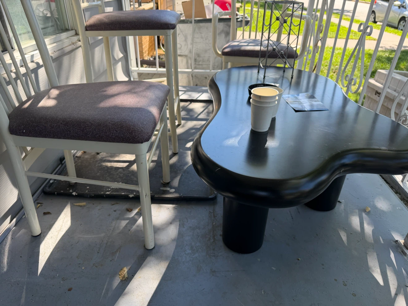 3 metal chairs plus Black Kidney Shaped Coffee Table