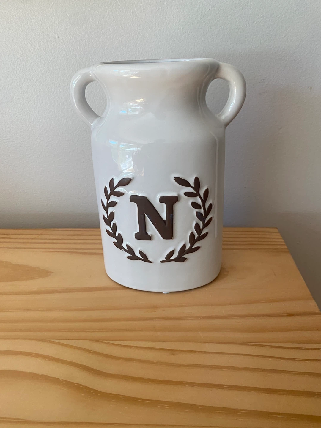 White ceramic decorative vase with N initial
