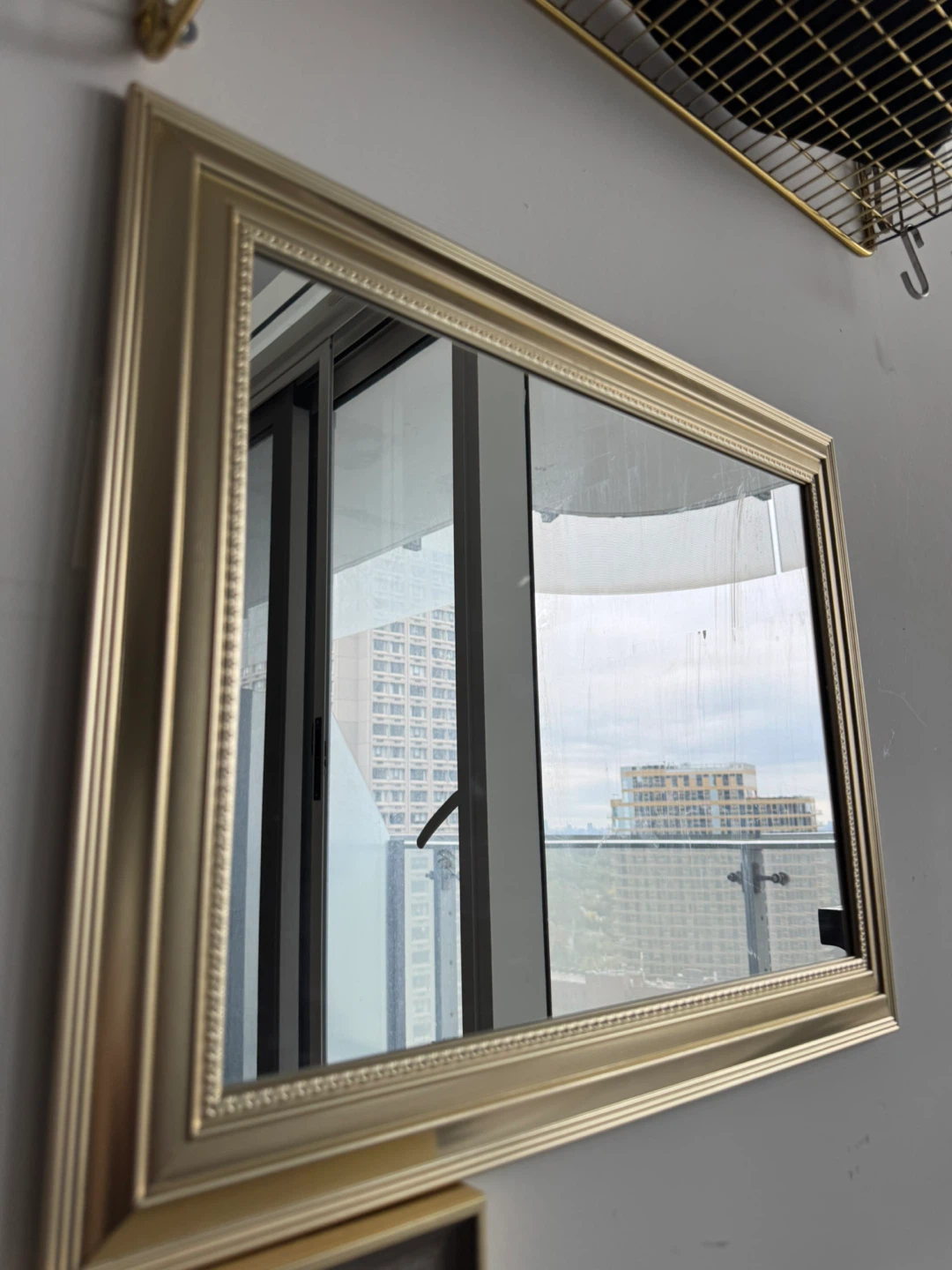 Gold Framed Wall Mirror reflection pictured